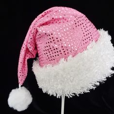 "This festive Santa hat is made up in a pink metallic dot pattern fabric. Great novelty party hat for your holiday celebration. Hat is styled in the traditional cone style stocking cap for Santa. The metallic fabric is lined with a layer of cotton fabric and the hat is accented with a band of fluffy white faux fur fabric trim. Proportions of the hat are generous and will fit most head sizes, ladies or gents. Hat is a soft slouch cone style. Measurement for opening for your head is 24-25\" circum Silver Santa Hat, Pink Winter Party Hats, Adjustable Pink Hats For Celebration, Pink Adjustable Hat For Celebration, Pink Adjustable Hat For Celebrations, Pink Santa Hat, Santa Costume, Holiday Hats, Santa Claus Hat