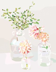 two vases with flowers in them on a table