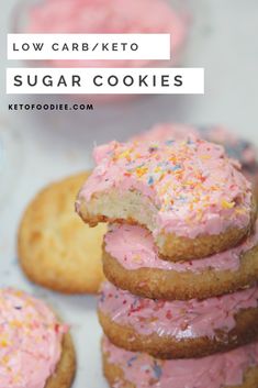 a stack of cookies with pink frosting and sprinkles