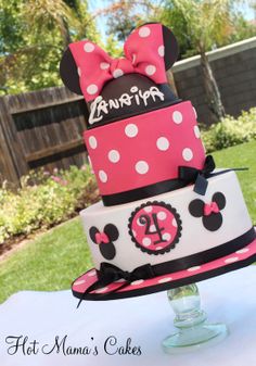 a minnie mouse birthday cake on a table