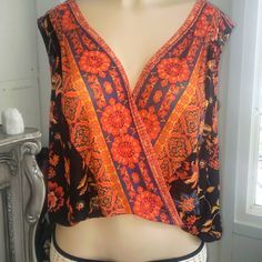 Free People Blouse. Nwt. Orange Black Sheer V-neck Rayon Top For Festival, Floral Print Wrap Tops For Vacation, Festival Floral Print V-neck Top, Festival Floral Print Rayon Tops, Sleeveless Bohemian Printed Blouse, Bohemian Sleeveless Printed Blouse, Flowy V-neck Top With Boho Print, Printed V-neck Top For Festival, Festival V-neck Printed Top