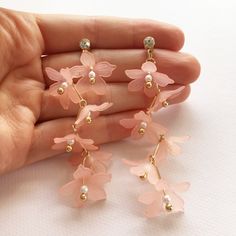 When you want your drop earrings to not just drop but plunge, these lightweight pretty blossom earrings will really steal the show and with 3 colours to choose from, you'll be able to match these perfectly with your fairy pastels. Each flower bead has a pretty imitation pearl nestled within, the colourful flowers hang down from each pin in a jaunty zig-zag formation. Each earring has 6 flowers to move and sway, framing your face with floral beauty.  Miss Kitsch UK shop: misskitschuk.etsy.com ♥ USEFUL INFORMATION ♥ ♦ Postage - UK - 2nd class post. Estimated delivery 2-3 days. In rare cases (outside of my control!) this can take up to 10 working days to arrive. If the order is urgent or is a gift for a certain date, it's recommended you pick one of the priced postage options at checkout. ♦ P Dangle Flower Earrings With 3d Flowers, Flower Decoration Drop Earrings For Summer, Spring 3d Flowers Dangle Earrings, Feminine Jewelry With Matching Earrings For Spring, Spring Party Petal-shaped Earrings, Pink Flower Drop Earrings, Feminine Spring Dangle Earrings, Pink Dangle Flower Earrings For Spring, Rose Gold Flower Earrings For Spring