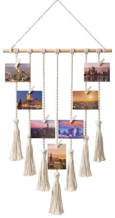 the hanging photo frame is decorated with tassels