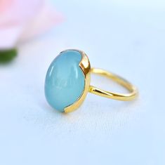 D E T A I L S - Material: Sterling silver 925 Stone: Aqua Chalcedony Stone Shape: Oval Stone Size: 12x16mm The fit: True to US ring size Finish: Smooth and Gold Plated to a high shine S H I P P I N G & P R O D U C T I O N - My current production time is 2-6 business days, which means after those days are up, your order ships! I make everything custom to order, by hand, but I promise you it's worth the wait! R U S H - M Y - O R D E R - If you're in a rush to get your pretty new pieces, please Yellow Gold Chalcedony Ring Gift, Chalcedony Rings Fine Jewelry For Gift, Round Opal Ring As Gift, Elegant Chalcedony Rings For Gift, Anniversary Chalcedony Ring With Polished Finish, Oval Chalcedony Rings For Anniversary, Adjustable Chalcedony Ring, Handmade Chalcedony Rings For Anniversary, Adjustable Round Chalcedony Ring