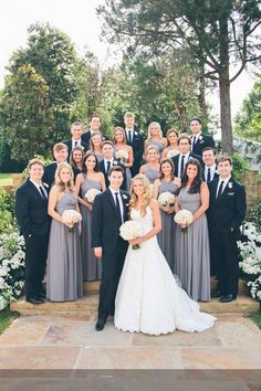 a bride and groom with their wedding party