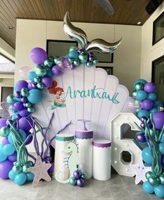 a mermaid themed birthday party with balloons and decorations