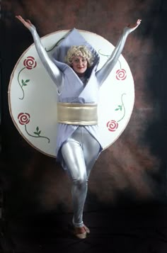 two pictures of a woman in white and silver with her arms outstretched, standing on top of a plate