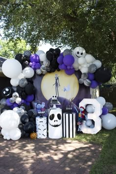 an outdoor party with balloons and decorations