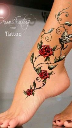 a woman's foot with tattoos on it and roses tattooed on the side of her leg