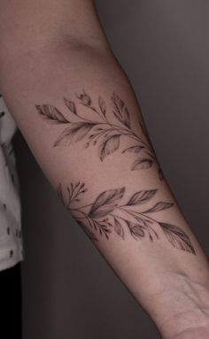 a person with a tattoo on their arm