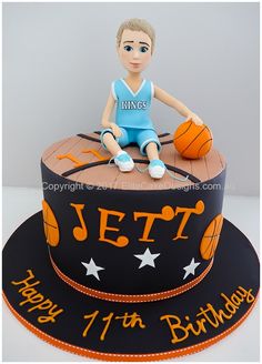 a birthday cake with a basketball player on top