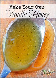 a spoon filled with vanilla honey on top of a wooden table