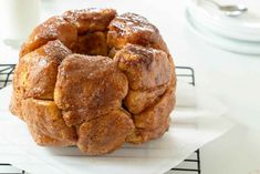 a bundt cake sitting on top of a white napkin next to a glass of milk