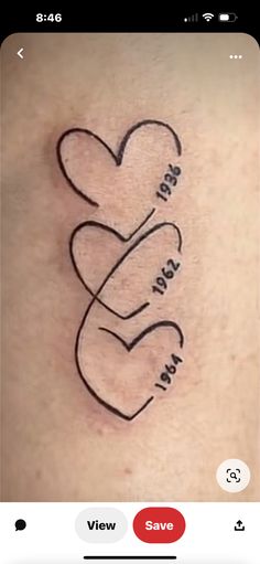 a tattoo with two hearts and the words i love you in cursive writing