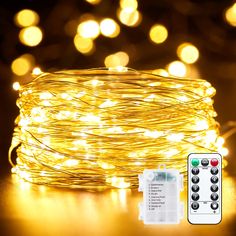 a close up of a string of lights on a table with remotes next to it