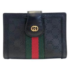 Gucci black web card holder featuring black monogram cloth and black leather, GG gold tone metal frontal logo, inside Gucci metal plaque, 2 internal compartment and plastic folder for cards, Made in Italy Dimensions: 9x7x2cm Condition: 1980s, vintage, excellent, like new Luxury Gucci Evening Wallets, Plastic Folders, Gg Logo, Gucci Wallet, Clip Wallet, Monogrammed Leather, Metal Plaque, Money Clip Wallet, Gucci Black