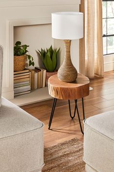 a living room scene with focus on the end table and lamp in the foreground