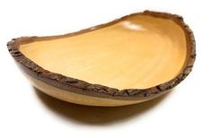 an empty wooden bowl on a white surface