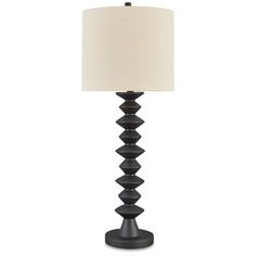 a black lamp with a white shade on it