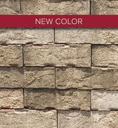 a brick wall with the words new color on it and a red border around it