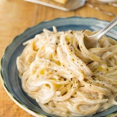 a plate of pasta with garlic and parmesan cheese