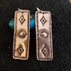 Handmade Hand-stamped Copper Dangle Earrings are designed using stamps made by the Navajo Indians from the Navajo Nation of New Mexico. They are .5 inches wide and 1.5 inches long. Sterling Silver ear wires. Free Shipping Nickel-free Rectangular Copper Jewelry, Artisan Nickel-free Rectangular Earrings, Handmade Southwestern Rectangular Jewelry, Southwestern Handmade Rectangular Jewelry, Cricut Maker 3, Stamped Earrings, Navajo Nation, Metal Etching, Southwest Jewelry