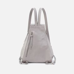 From festivals to farmer's markets, the Betta Backpack was purposefully designed for on-the-go living. Everyday Gray Backpack With Adjustable Strap, Gray Portable Backpack, Leather Backpack With Silver-tone Hardware For Travel, Travel Backpack With Silver-tone Hardware, Gray Rectangular Backpack With Anti-theft Pocket, Grey Backpacks, Brushed Nickel Hardware, Suede Leather, Zip Pockets