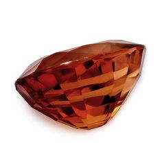 The deep burnt amber seems to add a glowing charm to this 10.27 carat Mandarin Garnet. The gems exceptional hardness makes it a suitable choice for rings and bracelets, as it tends to withstand a lot of wear and tear. Cut as an oval, a trending shape, this garnet will have you lost for words when it comes to sparkle. Catching the light in all the right angles, this golden hued mahogany gem perfectly brings the colors of fall into one. Luxury High Luster Gemstones For Formal Occasions, Luxury Faceted Amber Jewelry, Formal Faceted Amber Jewelry, Luxury Gemstones With Large Stone For Formal Events, Luxury Large Stone Gemstones For Formal Occasions, Mandarin Garnet, Lost For Words, Rings And Bracelets, Colors Of Fall