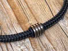 Men black paracord necklace with bronze ring. Also for womens. Paracord 5 mm Stainless steel bronze ring and rubber rings Stainless steel strong magnetic clasp If you sending the item as a gift, please let us know. We can enclosed a gift note for you as well. Handmade Black Nylon Cord Jewelry, Handmade Black Jewelry With Nylon Cord, Handmade Adjustable Gunmetal Jewelry, Adjustable Bronze Choker As A Gift, Black Adjustable Necklace For Everyday Use, Adjustable Black Necklace For Everyday Use, Black Jewelry With Adjustable Length For Everyday, Black Nylon Cord Jewelry As Gift, Metal Jewelry With Black Band For Gift