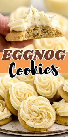 eggnog cookies with white frosting on top and in the background, there is a hand holding an eggnog cookie