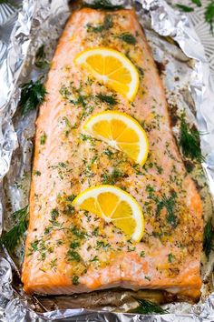 baked salmon with lemons and herbs on foil