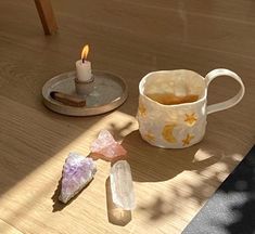 a cup of tea and some rocks on a table