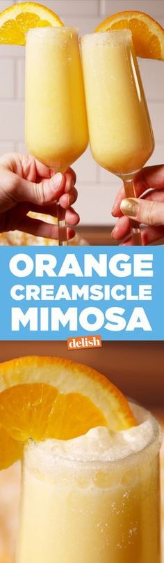 orange creamsice mimosa with two hands holding the glasses and one is half full