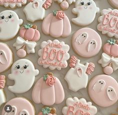 decorated cookies with pink and white icing for a baby shower