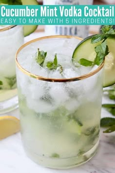 two glasses filled with cucumber mint vodka cocktails on top of a marble counter