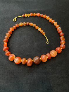 Ancient Indo-Tibetan agate beads necklace very beautiful color and very smooth skin of this agates we provide fast and free shipping to our customers by which can get the items by 7 maximum working days Carnelian Round Beads Crystal Necklace, Single Strand Agate Beaded Necklaces With Round Beads, Single Strand Agate Crystal Necklace With Round Beads, Amber Beaded Agate Necklace, Artisan Agate Bead Crystal Necklaces, Carnelian Single Strand Necklace For Healing, Spiritual Single Strand Agate Necklace, Single Strand Carnelian Necklace For Healing, Amber Single Strand Spiritual Necklace