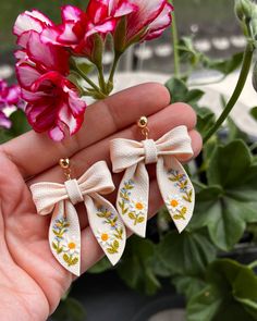 the small bow earrings are decorated with flowers