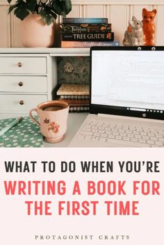 a laptop computer sitting on top of a desk next to a cup of coffee and books