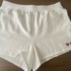 White, Comfortable Sleeping Shorts, With Two Strawberries In The Bottom Corner In A Size Xl From Pink. Comfortable White Cotton Athletic Shorts, Comfortable White Cotton Pajama Shorts, White Cotton Pajama Shorts For Leisure, Leisure White Cotton Pajama Shorts, White Cotton Pajama Shorts, White Relaxed Fit Pajama Shorts For Leisure, Casual White Athletic Shorts With Short Inseam, Comfortable White Bottoms With Built-in Shorts, White Pajama Shorts With Elastic Waistband For Leisure