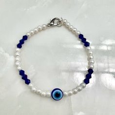 *Size: One Size *Color: Dark Blue/White *Product Detail: Good Quality Beads. Stretchy Elastic Band W/ Silver Clasps. 1 Dark Blue Evil Eye Pearl Beaded Bracelet With Alternating Dark Blue Crystals. (Message For Customized Letters & Bead Color Preferences) *Condition: 100% Handmade. Brand New. *Note: Customizable Bracelet. Made To Order In 2-3 Days. Message Preference For Custom Colored Evil Eye & Custom Colored Beads. *Note: Great Gifts For Party Bags. Message For Multiple Bracelets. Adjustable Blue Beaded Bracelets With Evil Eye, Blue Pearl Beaded Bracelets With Pearl Charm, Adjustable Blue Beaded Bracelet With Pearl Charm, Adjustable Blue Beaded Evil Eye Bracelets, Blue Beaded Bracelet With Pearl Charm, Adjustable Blue Evil Eye Bracelet With Colorful Beads, Blue Pearl Bracelets With Pearl Charm, Blue Pearl Bracelet With Pearl Charm, Blue Metal Bracelet With Evil Eye