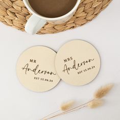 two personalized coasters sitting next to a cup of coffee