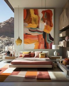 a bedroom with a large painting on the wall and colorful bedding in front of it