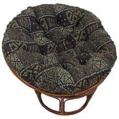 a brown and black chair cushion sitting on top of a wooden table