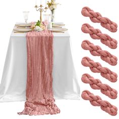 the table is set with pink and white linens