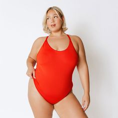 An adjustable criss-cross back detail and a scoop neck lend sporty vibes to this luxe suit! Our Freestyle One-Piece has a no-fuss fit and comfortable, quick-drying fabric. Fully-lined Full coverage Removable bust pads FREE U.S. Standard Shipping! More info hereModels are wearing size XS90% NYLON - 10% SPANDEXHand wash cold and lay flat to dry Red Stretch Scoop Neck Swimwear, Athleisure Stretch Swimwear With Scoop Neck, Athleisure Stretch Scoop Neck Swimwear, Stretch Scoop Neck Athleisure Swimwear, Red Athleisure Swimwear For Summer, Sporty Solid Color Scoop Neck Swimwear, Red Athleisure Swimwear For Workout, Solid Scoop Neck Swimwear For Workout, Sporty Second-skin Swimwear For Sports