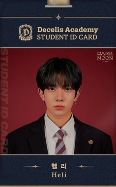 a young man in a suit and tie is wearing a name badge on his id card