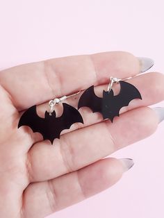 Customizable Bat Earrings ♡ Size: 1.25" x 0.75" ♡ Example color is in Black ♡ All jewelry is made with hypoallergenic stainless steel, so it's 100% safe for anyone with metal allergies♡ These earrings are the perfect statement piece for anyone to wear, and a beautiful gift to give friends and family.♡ Each pair of earring is individually wrapped and securely shipped.The earrings cannot be exchanged, returned, or refunded, but if there is a problem with your order, please contact me and I would b Themed Black Metal Jewelry, Trendy Silver Halloween Earrings, Trendy Halloween Earrings As A Gift, Gothic Surgical Steel Jewelry For Gifts, Gothic Surgical Steel Jewelry Gift, Trendy Halloween Earrings For Gift, Hypoallergenic Punk Dangle Earrings, Hypoallergenic Dangle Earrings In Punk Style, Gift Dangle Earrings