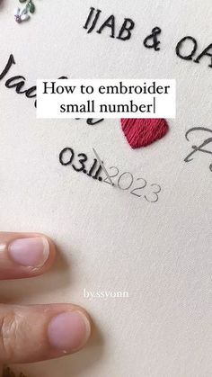 someone's hand with nail polish on top of a piece of paper that says, how to embroider small number