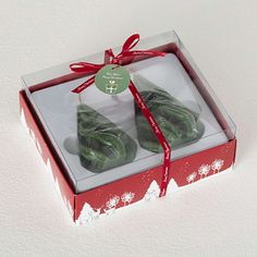 two green donuts in a red gift box