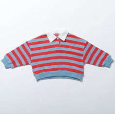 The Rascal Rugby Striped Boys Shirts combine classic prep with a touch of mischief, featuring a stylish polo collar layered underneath bold rugby stripes. Material: Organic Cotton | Colors: Red & Blue Stripe, Navy & White Stripe | Sizes: XS, S, M, L, XL, XXL Preppy Tops With Striped Polo Collar, Preppy Polo Collar Top With Striped Details, Preppy Top With Striped Polo Collar, Preppy Collared Tops For College, Red Polo Shirt With Striped Collar, Red Polo Top With Striped Collar, Preppy Striped Polo Collar Top, Red Cotton Polo Shirt With Striped Collar, Rugby Polo